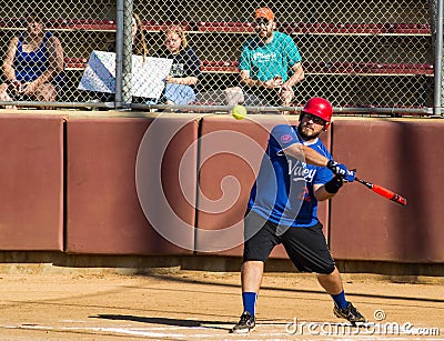 Batter Hitting a Softball - Special Olympics Editorial Stock Photo